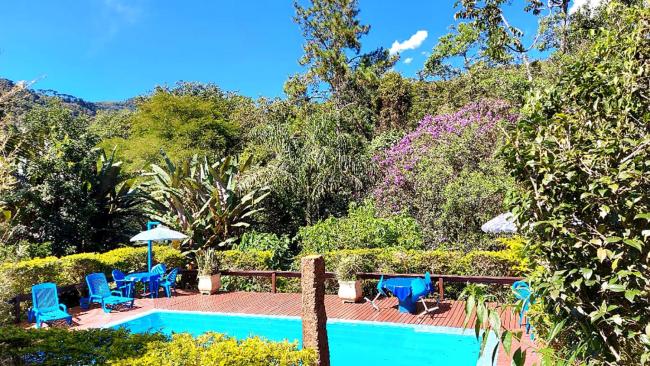 Suite com lareira na Pousada Recanto da Montanha Images_5