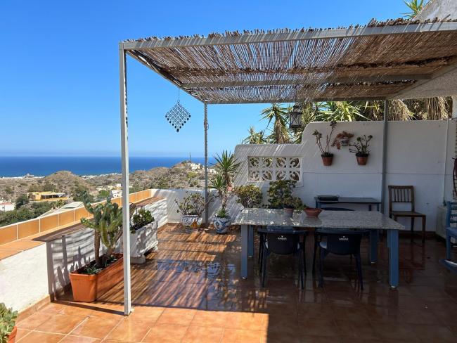 Apartment with a great terrace, sea and land views Images
